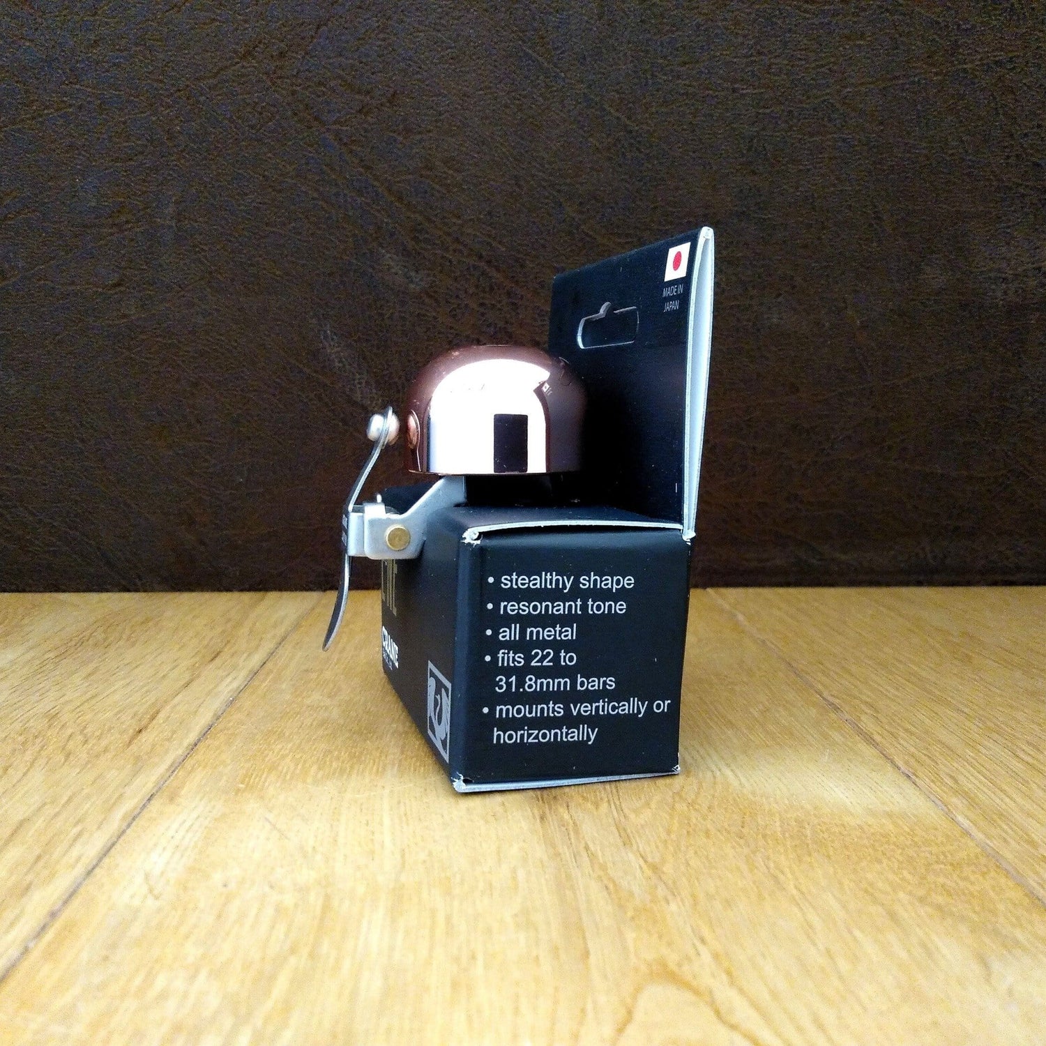 Crane Copper E-NE bike bell in retail packaging viewed from end